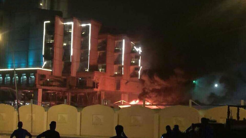 بالصور .. تفجيرا فندق بابل ونادي العلوية وسط بغداد