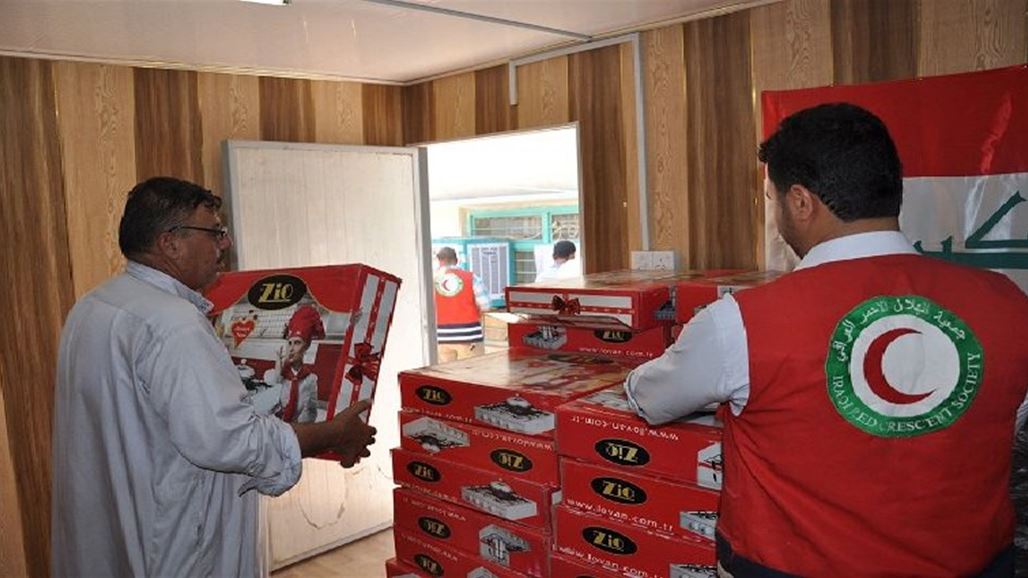 الهلال الأحمر يوزع ألف حصة غذائية للنازحين في كركوك