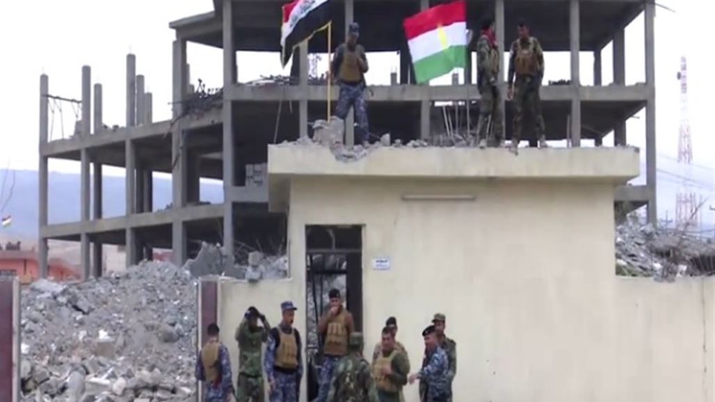 رفع العلم العراقي فوق مبنى قائممقامية قضاء سنجار