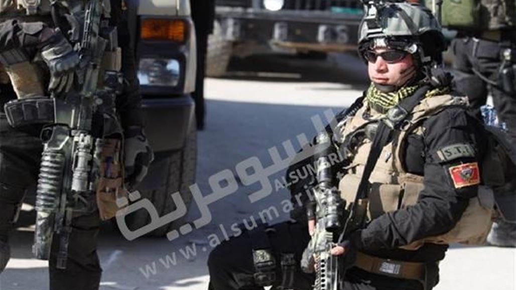 جهاز مكافحة الارهاب يحرر حي البكر ويرفع العلم العراقي فوق احد مبانيه