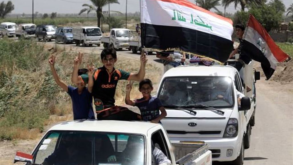 بالصور.. قوافل العائدين إلى بغداد تحت ظل العلم العراقي