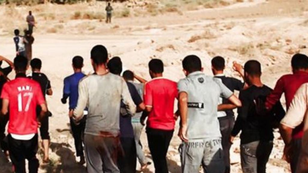 بالصور.. ابناء الموصل يقفون حدادا على مجزرة سبايكر