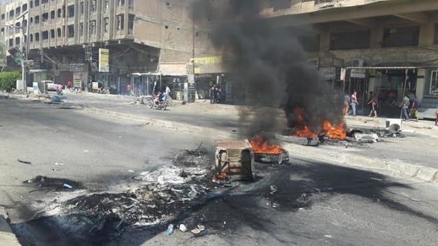 سقوط اول ضابطين قتلى في ذي قار الان وسيارة للشرطة تدهس عدداً من المتظاهرين