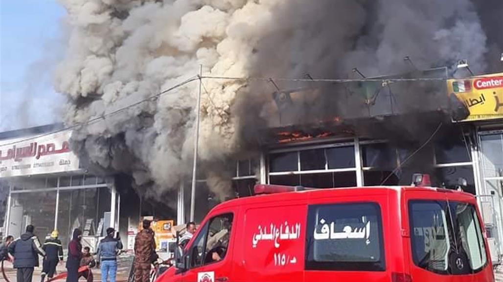 بالصور.. اخماد حريق داخل محال تجارية في كربلاء 