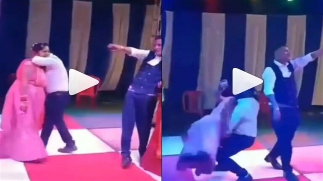 عروسان يسقطان أرضا أثناء الرقص بسبب وزن الزوجة! (فيديو)