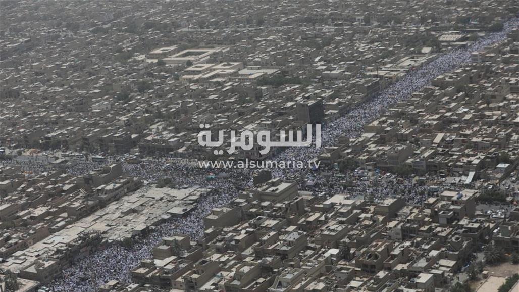 شارع الفلاح يغص بمرتدي الأكفان.. صور جوية خلال الصلاة الموحدة في مدينة الصدر