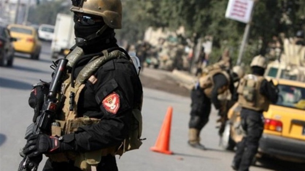 اعتقال متسول متنكر بزي نسائي في بغداد (صور)