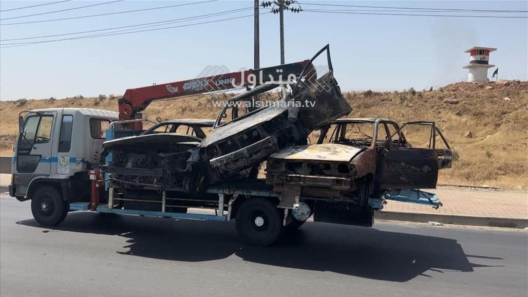 "سيارات التهمتها النيران".. مشاهد من آثار الدمار التي خلفتها أحداث كركوك