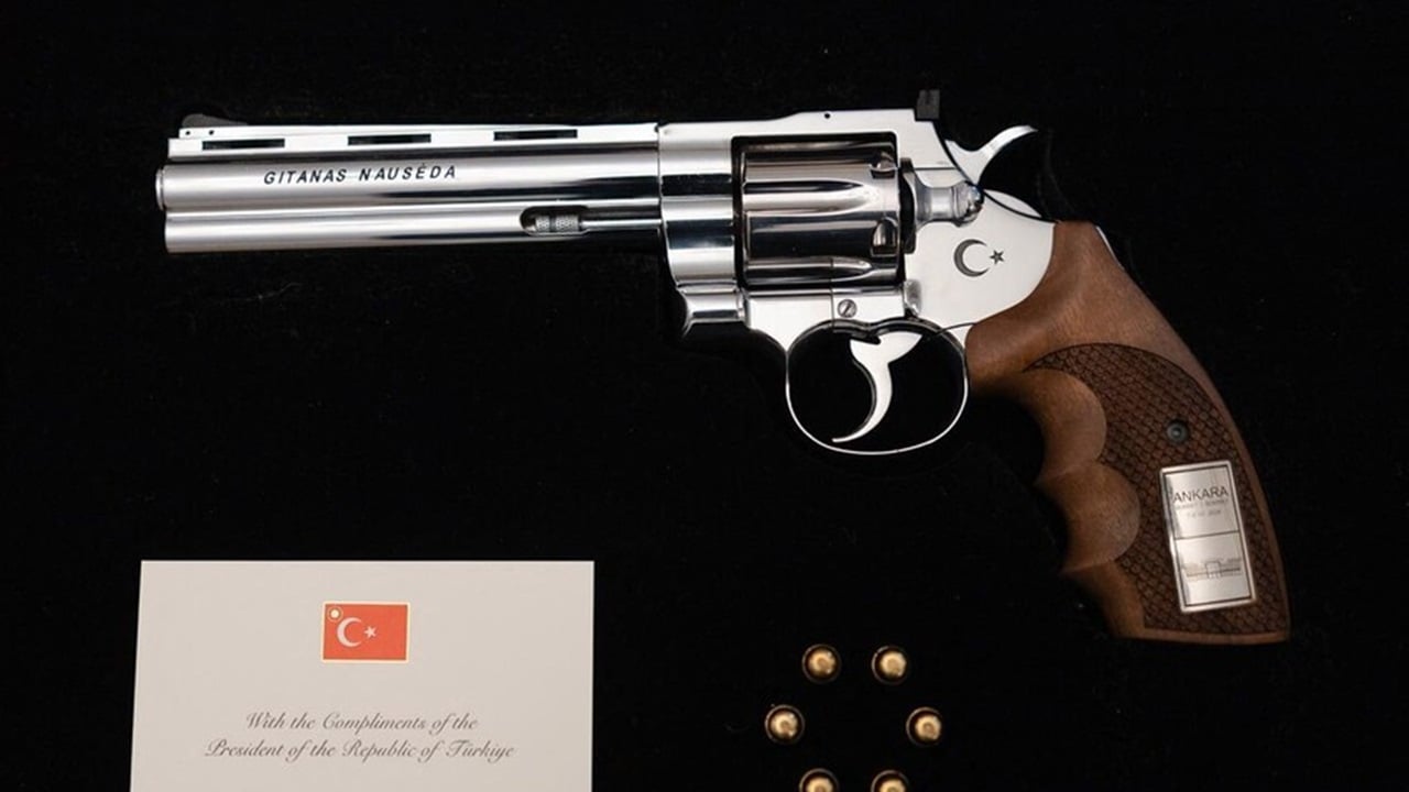 Erdogan gifts Trump gold-plated pistol at NATO summit