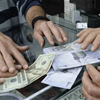 العملة الإيرانية تواصل الانهيار امام الدولار