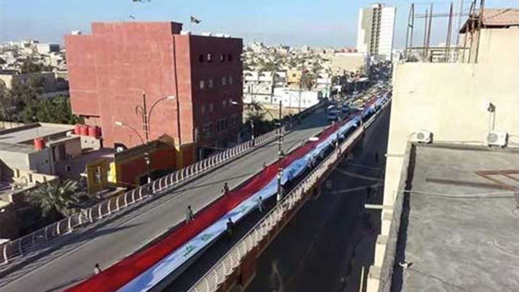 بالصور: أطول علم عراقي يرتفع في البصرة