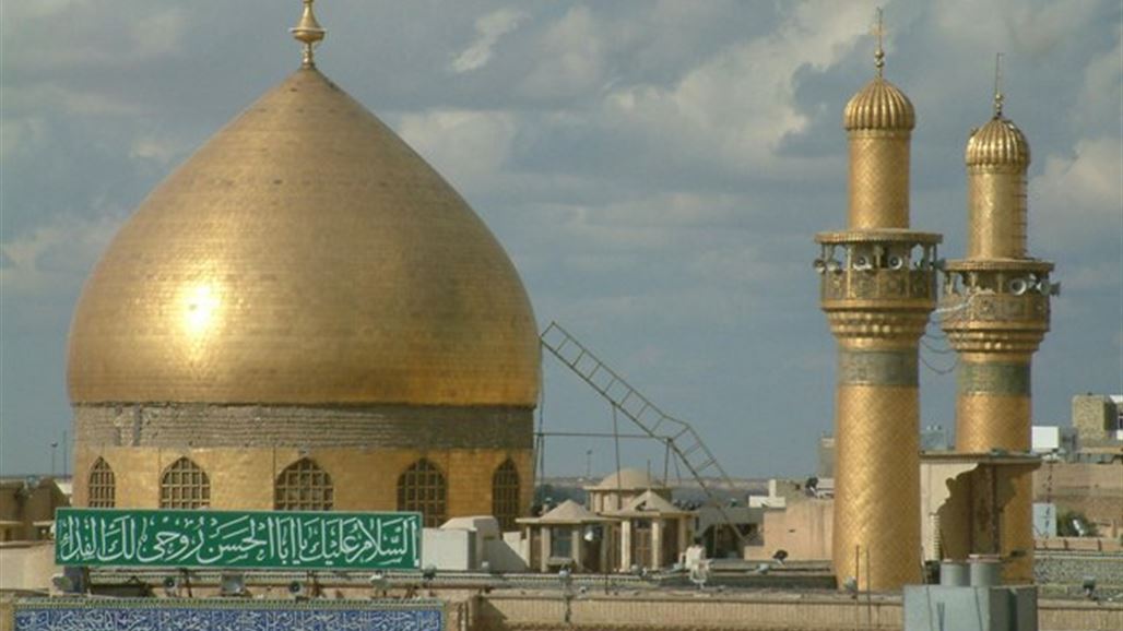 فرق الاطفاء تطوق حريقا اندلع قرب مرقد الامام علي بالنجف
