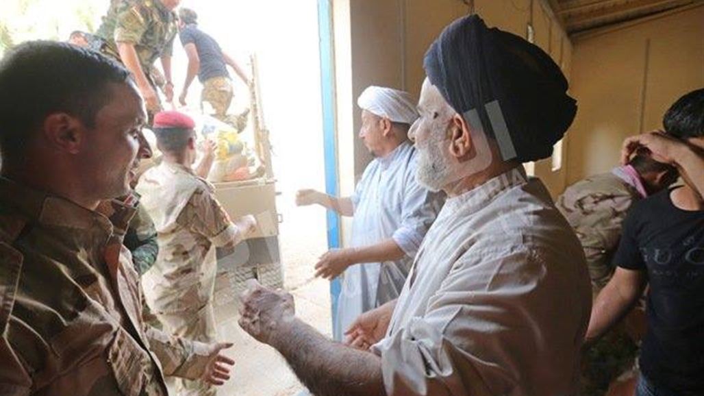 توزيع مساعدات من المرجعية بين مقاتلي عشيرة البو نمر في حديثة