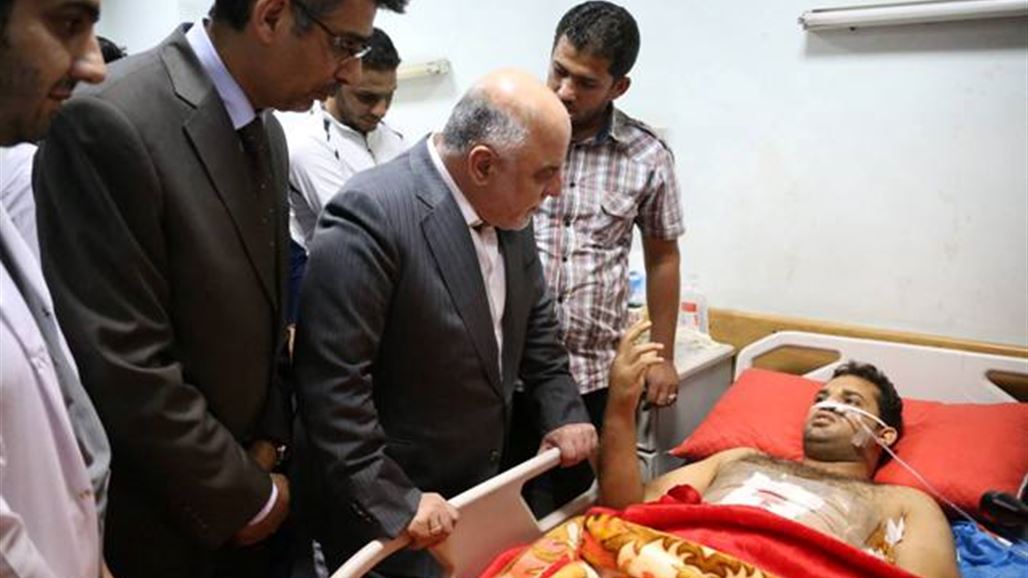 العبادي يزور جرحى تفجيرات بغداد