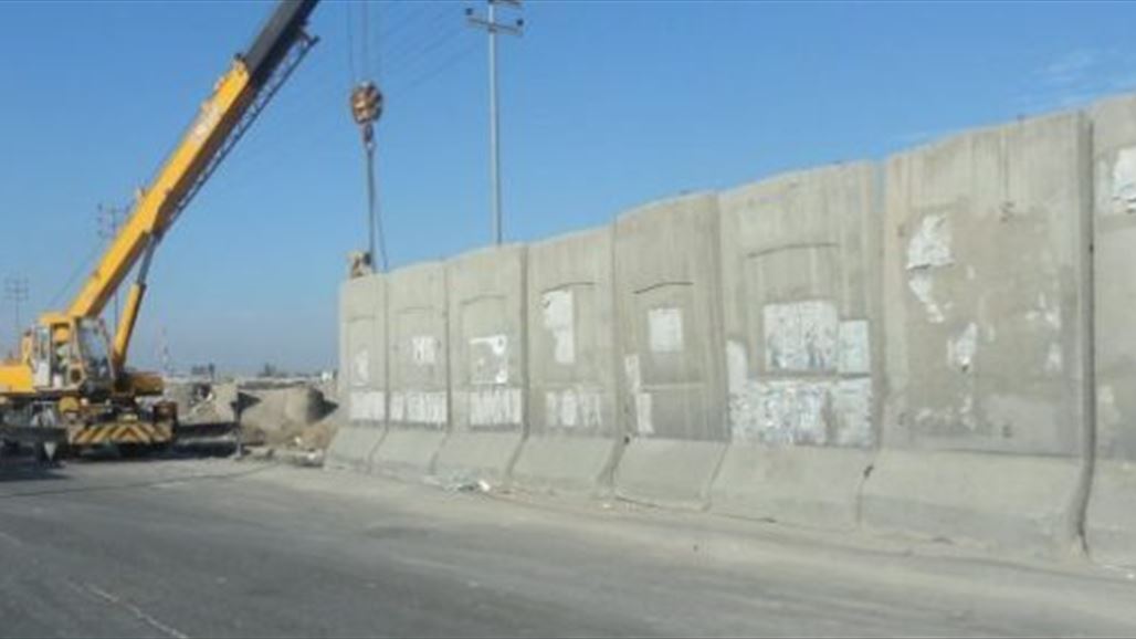 بالصور .. الحواجز الصماء في بغداد تنطق بأسماء مبدعي العراق