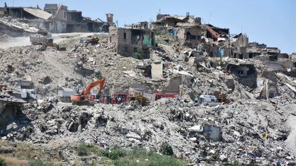 بالصور.. عمليات إنتشال الجثث في أيمن الموصل